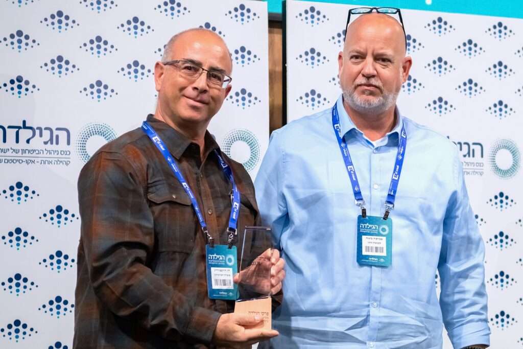 פרסי הגילדה 2025 - דן רוזנצוויג | כנס הגילדה השנתי 2025 - כנס ניהול הביטחון של ישראל